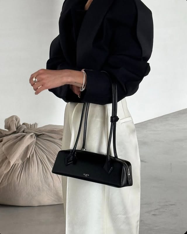 Instagram post by @whereiskhatia for Mytheresa. Caption reads: @mytheresa.com presents a refined take on modern....