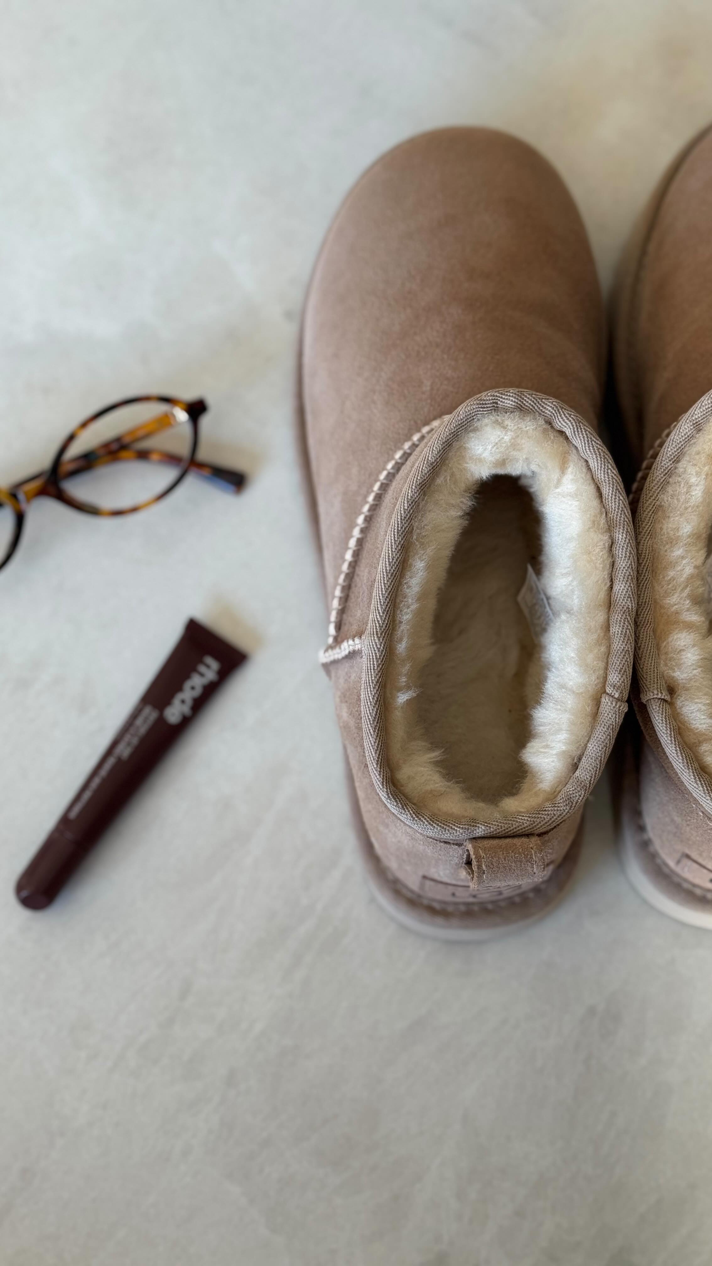 Instagram post by @nathyehezkel for Shop2gether. Caption reads: A day in the city with the coolest boots....