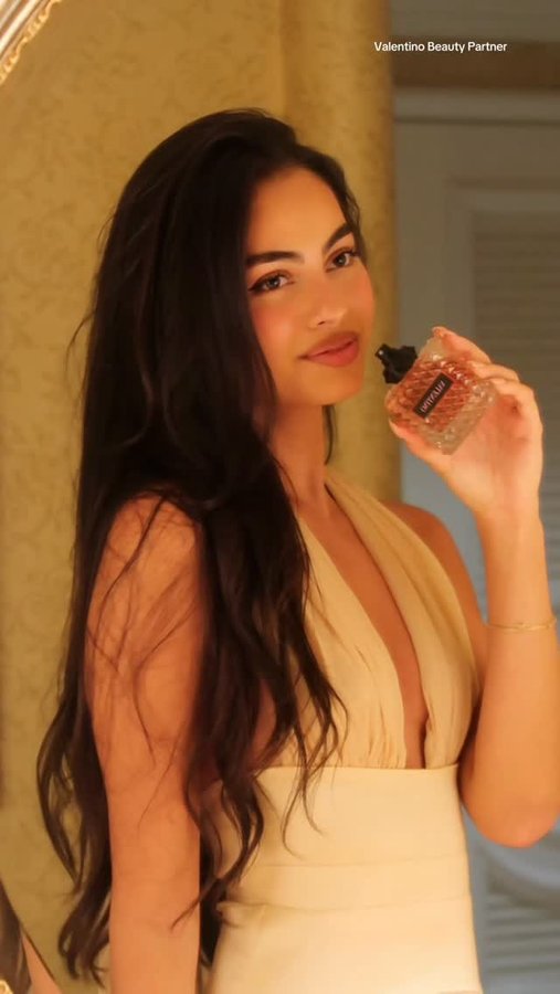 Instagram post by @nicolesahebi for Valentino Beauty. Caption reads: #Ad One spritz and everything shifts.....