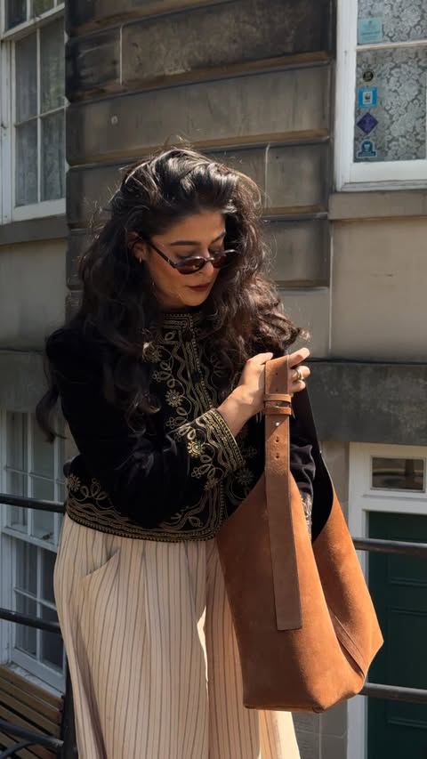 Instagram post by @sannashenna for Strathberry. Caption reads: [...] Sunnies @jimmyfairly Bag @strathberry Gifted....