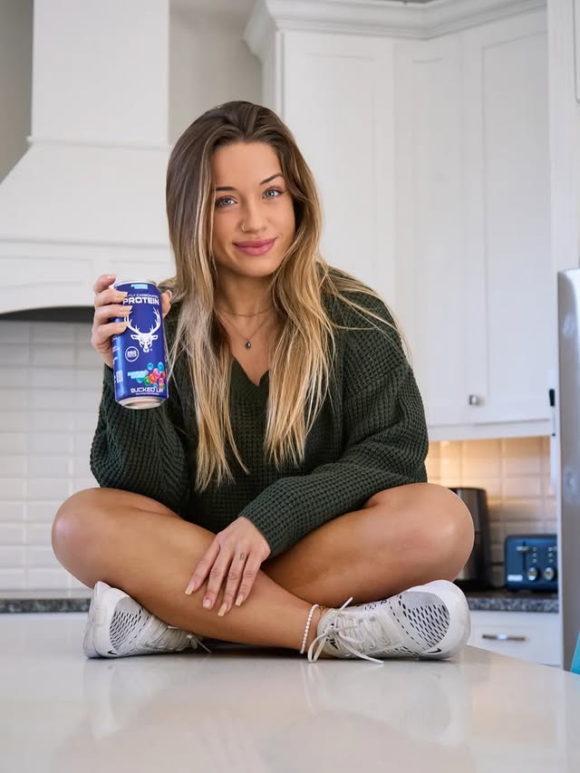 Instagram post by @caleigh.mackenzie for Bucked Up. Caption reads: my smile says it all @buckedup CODE: CALEIGH.