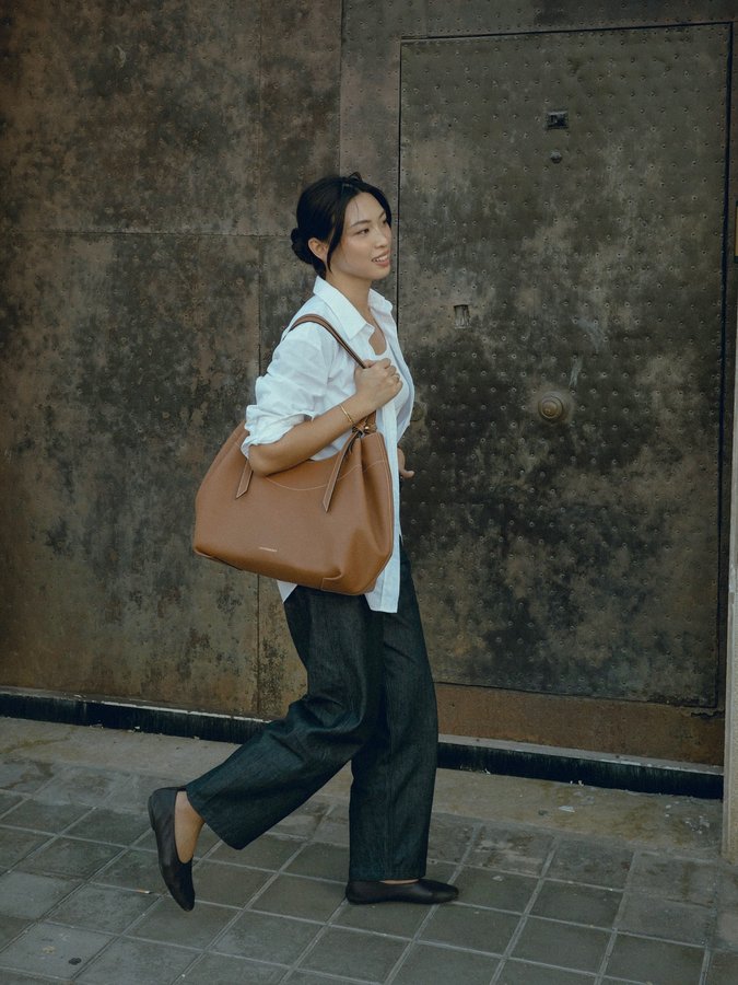 Instagram post by @michellelin.lin for Strathberry. Caption reads: [...] Barra tote for running errands @strathberry....