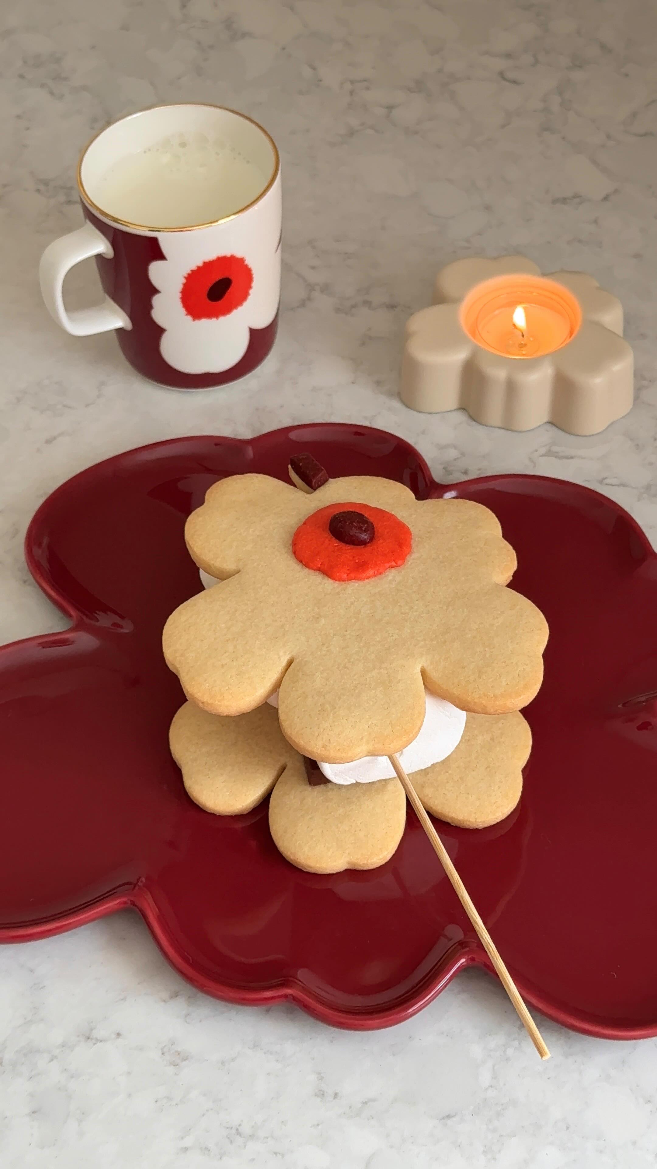 Instagram post by @_yu.jung for Marimekko. Caption reads: ad - let’s make @marimekko Unikko s‘mores....