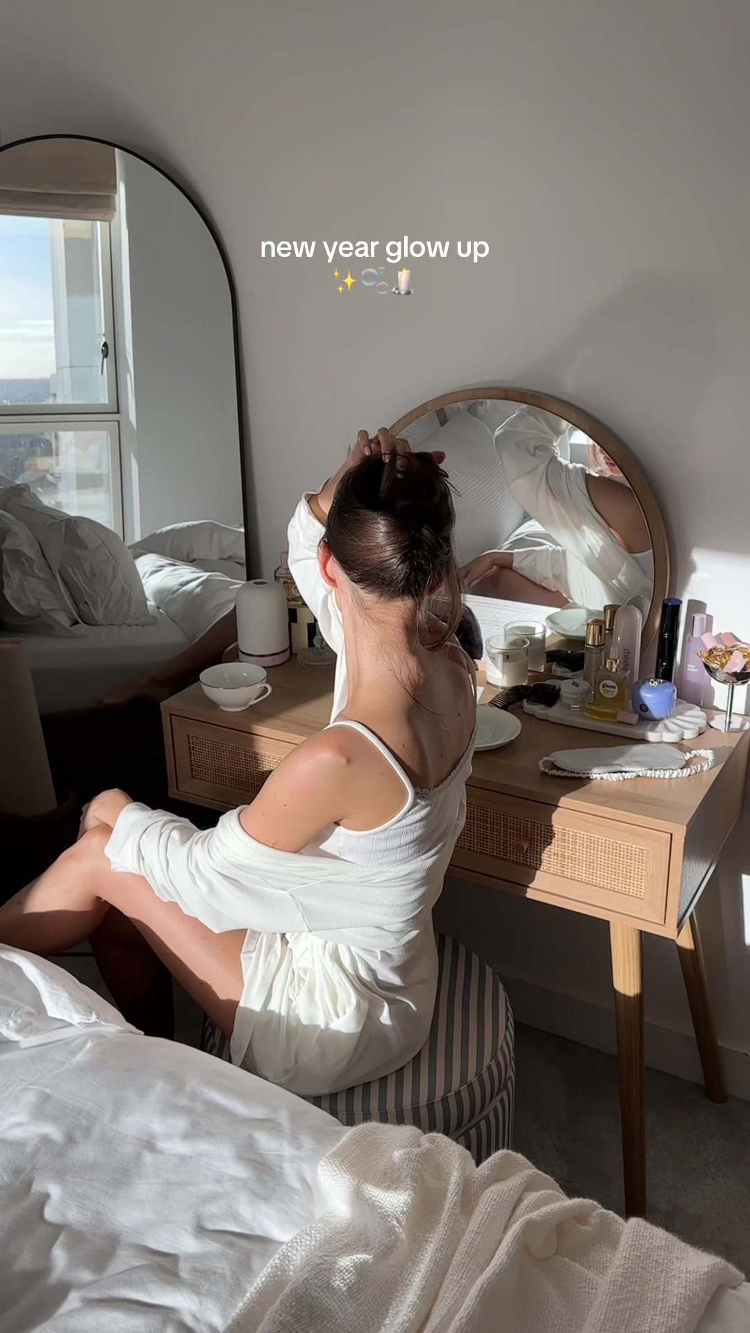 TikTok post by @adelinavolynskaia for balibody. Caption reads: Ending the year glowing ✨ using @balibody Clear....