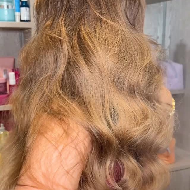 Instagram post by @byemmaleah for Gisou. Caption reads: post beach hair wash 🫧🧖🏼‍♀️🎀🌺🧡🌞🌊 

spent....