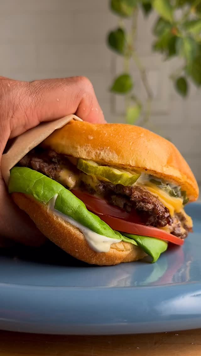 Instagram post by @whisperofyum for Safeway. Caption reads: Summer eating with these smash burgers with....