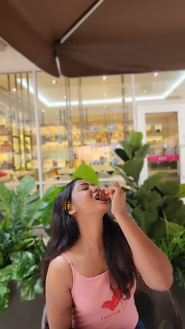 Instagram post by @shrutireddyy for Godiva. Caption reads: 🍓🍫 ☕️ Heaven on earth @godiva love you! ♥️✨.