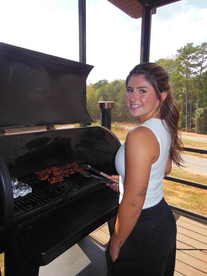 Instagram post by @hailiedeegan for Pit Boss Grills. Caption reads: Dinner’s ready 😉 @pitbossgrills.