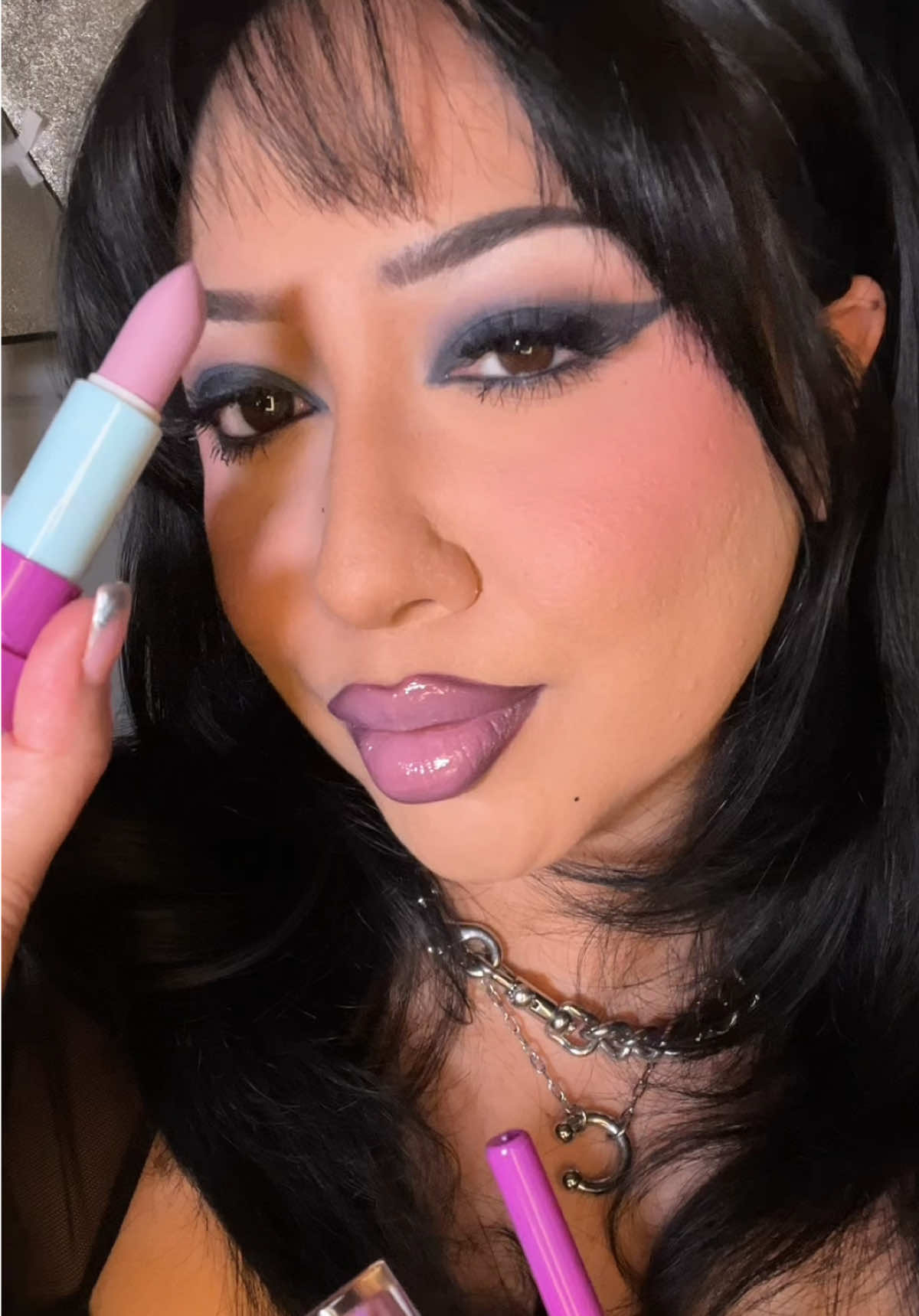 TikTok post by @eveysolorio for Glamlite Cosmetics. Caption reads: Ooou this lip with a smokey wing 🙂‍↔️ @Glamlite....