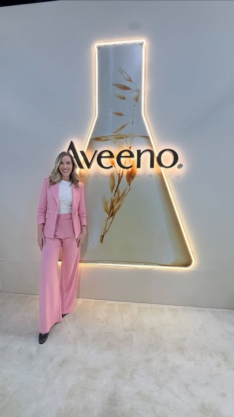 Instagram post by @thebudgetdermatologist for Aveeno. Caption reads: #AveenoPartner Made it to the Aveeno® booth in....