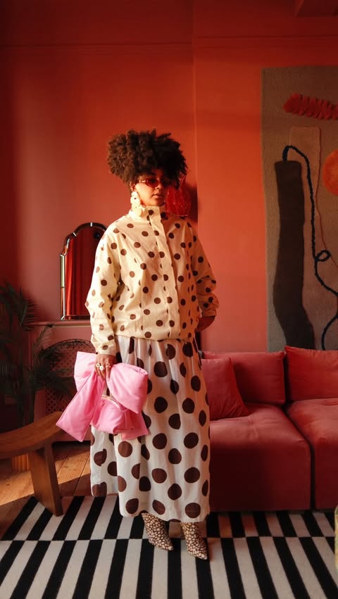 Instagram post by an influencer for Anthropologie. Caption reads: [...] so cute !! @asos jacket @anthropologie skirt....