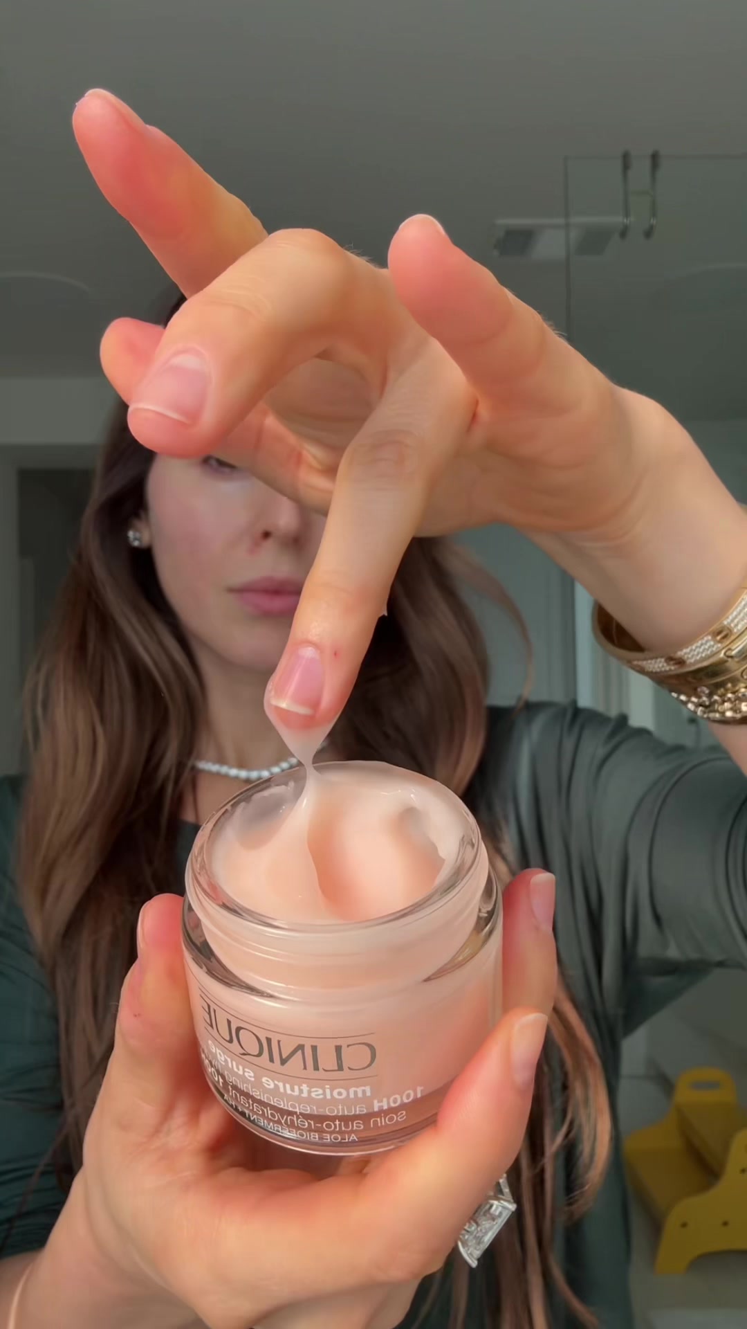 TikTok post by @itsjennarennert for Clinique. Caption reads: my year round skin savior @Clinique Moisture Surge....