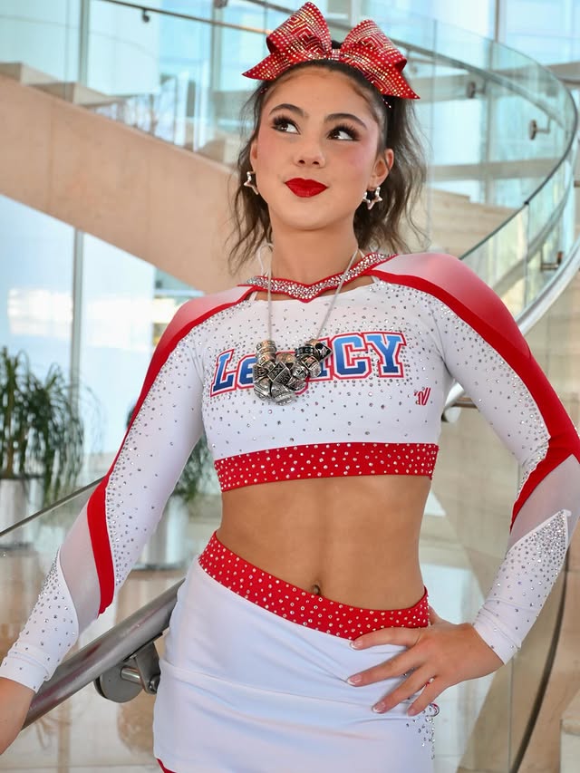 Instagram post by @llcheer for Nfinity. Caption reads: It’s been a minute… is my bow straight? #nfinity....