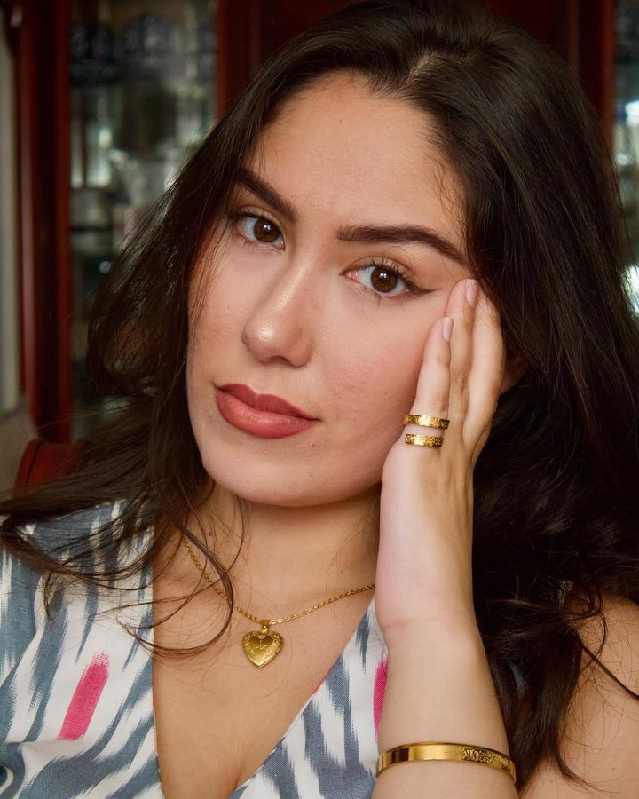 Instagram post by @malika.burieva for ZUDO. Caption reads: [...] 🥰 fit: @nomad__threads 🫶🏻 jewelry:....