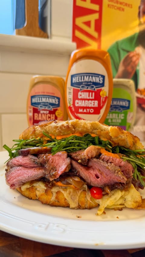 Instagram post by @thegrubworkskitchen for Hellmann's. Caption reads: [...] steak sandwich 🥪 A flame grilled....