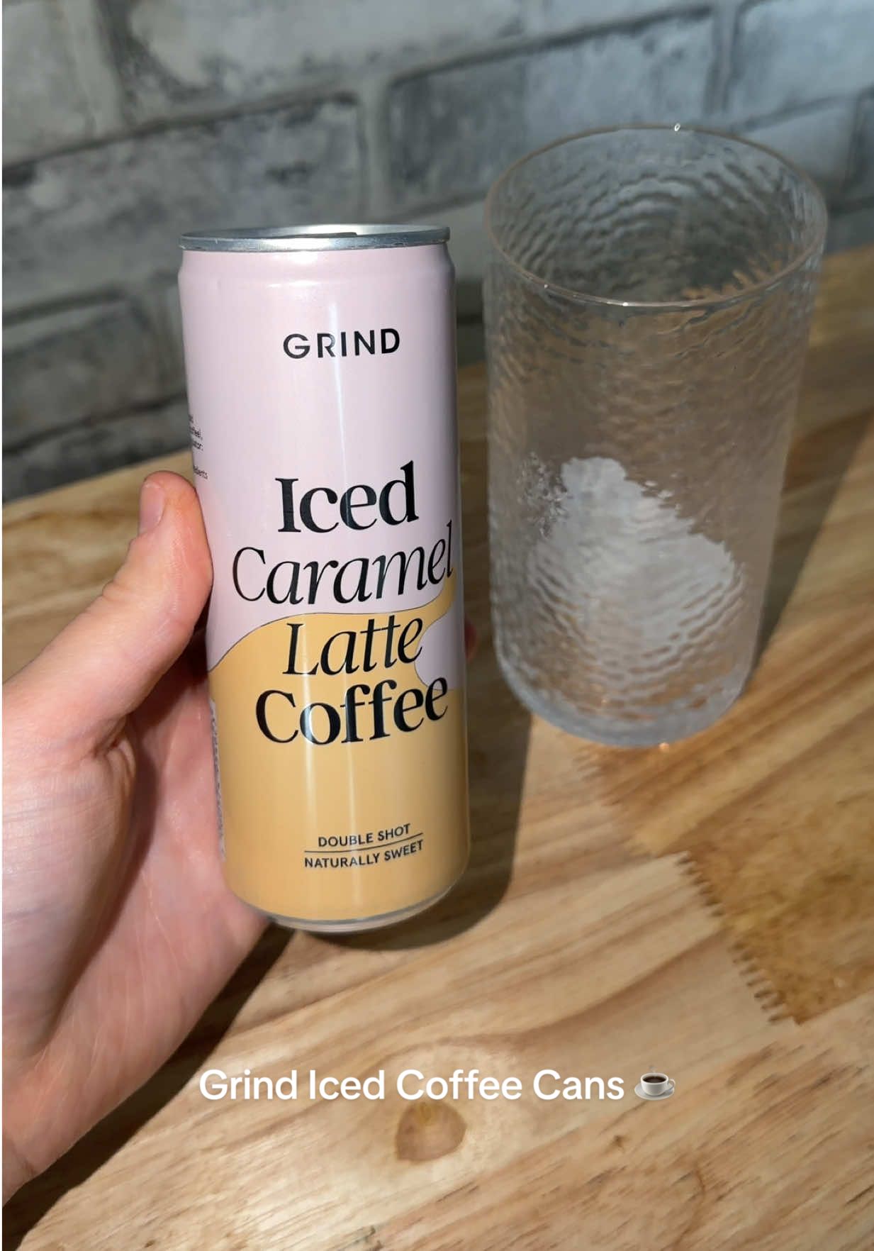 TikTok post by @emmafayedocherty for Grind. Caption reads: Grind Iced Coffee Cans ☕️ @Grind @Social Tip [...].