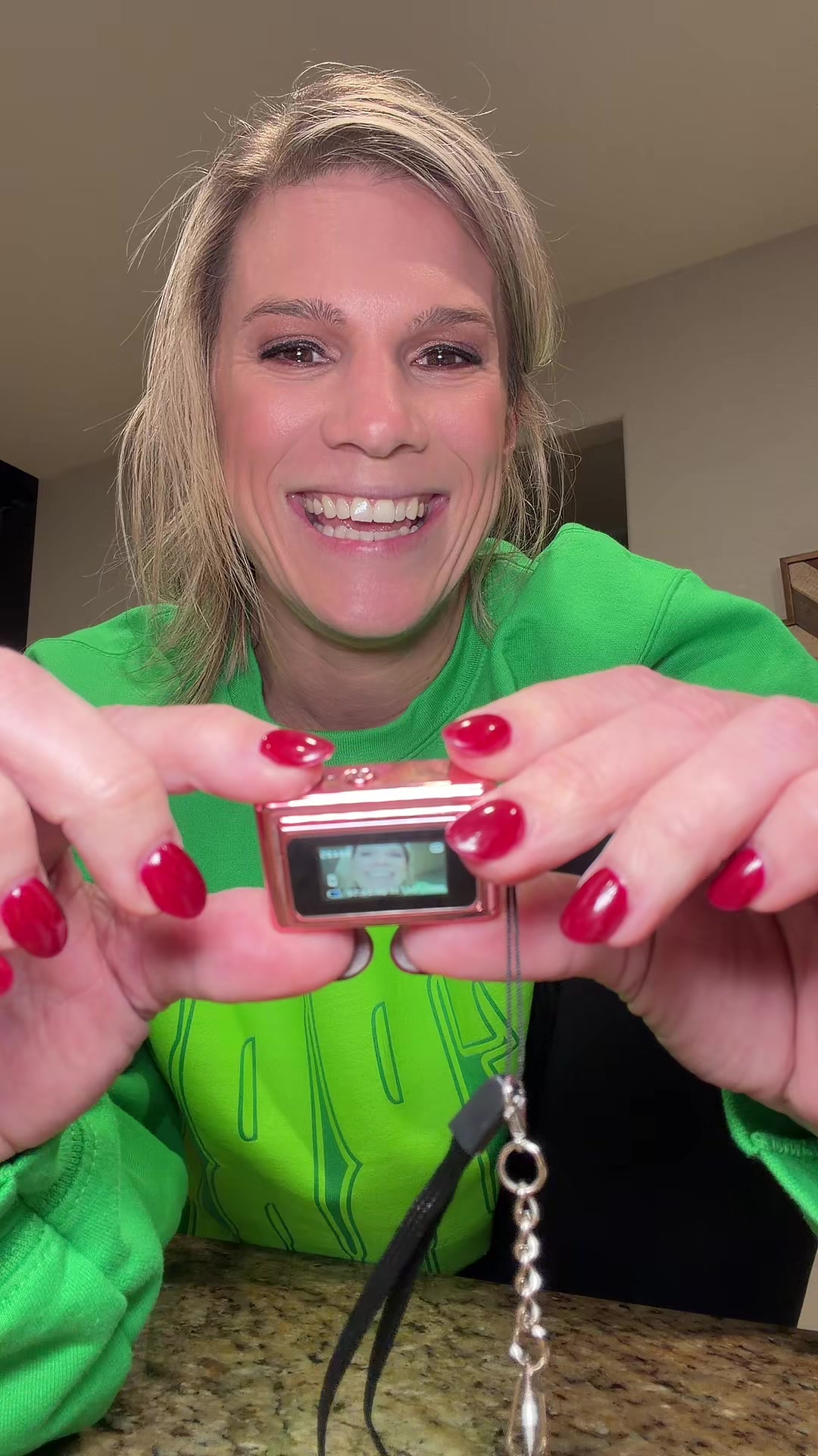 TikTok post by @thamillsfam for Fitpolo. Caption reads: ✨ Smile 😊📸 because this mini pocket digital....