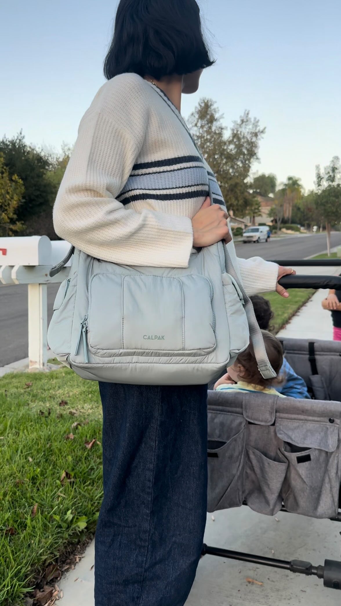 Instagram post by @_marissaalmquist for CALPAK. Caption reads: [...] can keep up — and look cute doing it!....