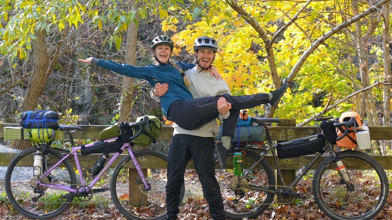 YouTube post by @NickandKatieMTB for OutdoorMaster. Caption reads: Our First Bikepacking Overnighter (What it's....