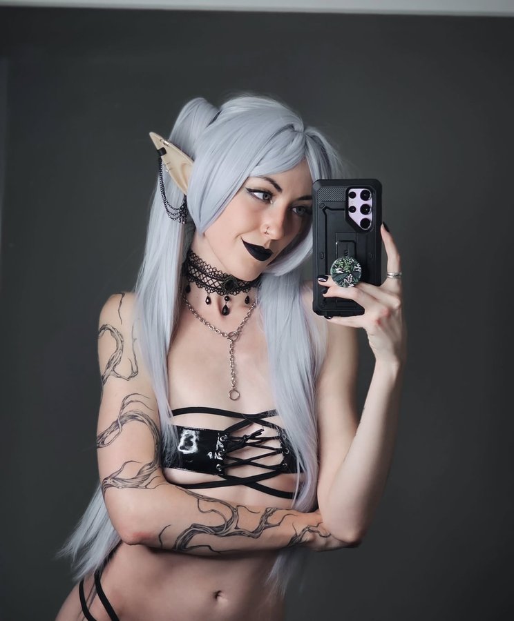 Instagram post by @ocea_wave for MoeFlavor. Caption reads: [...] as goth Frieren ( 〃▽〃)

Outfit from....