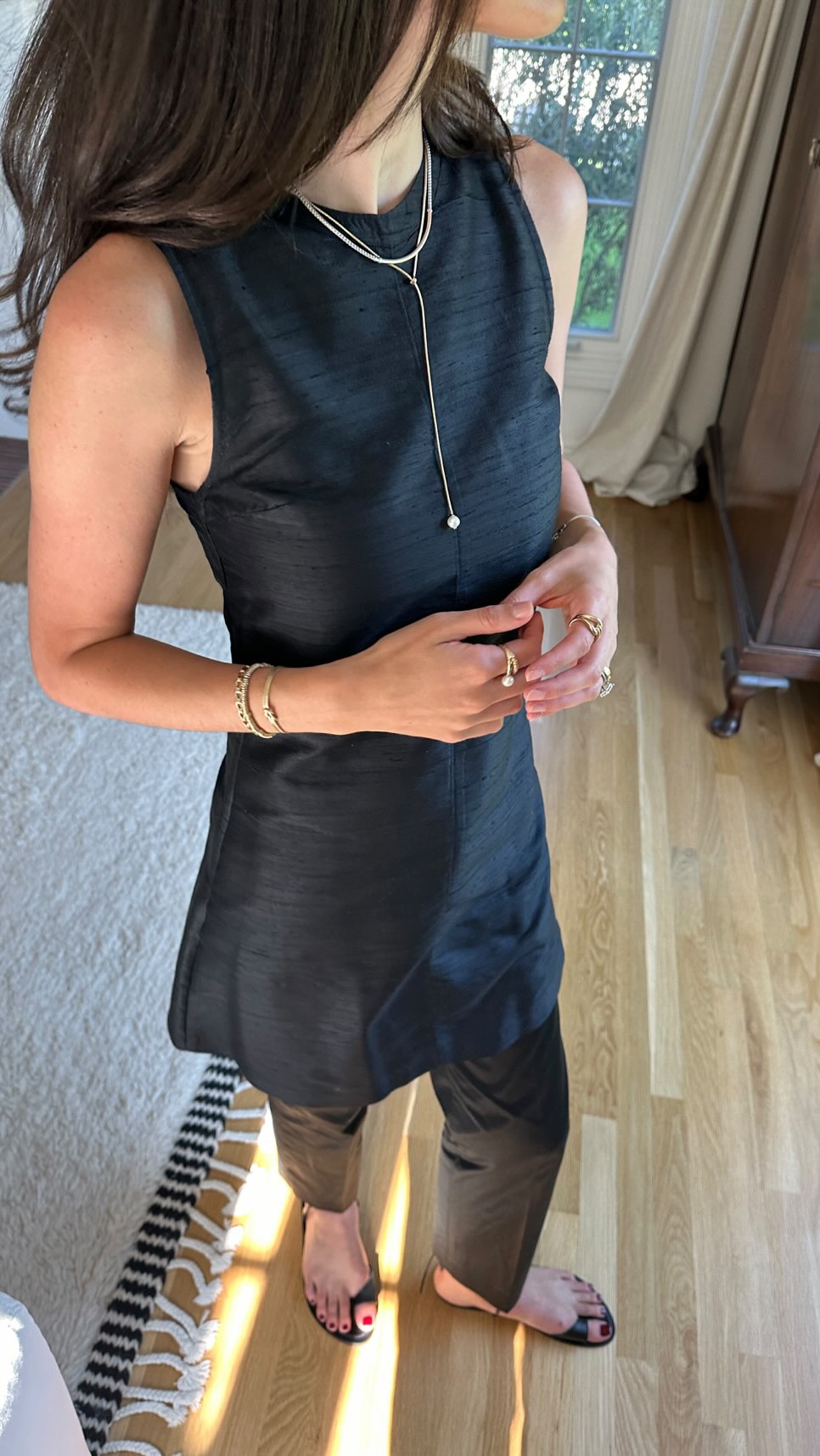 Instagram post by @ilanatorbiner for John Hardy. Caption reads: Summer layering by way of jewelry stacking....