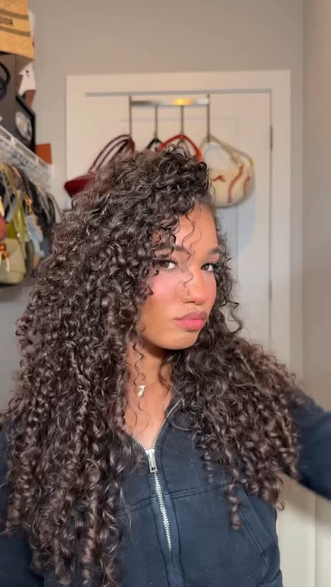 Instagram post by @ashleescurls for CURLSMITH. Caption reads: [...] voluminous curls 👩🏽‍🦱🤭 The....