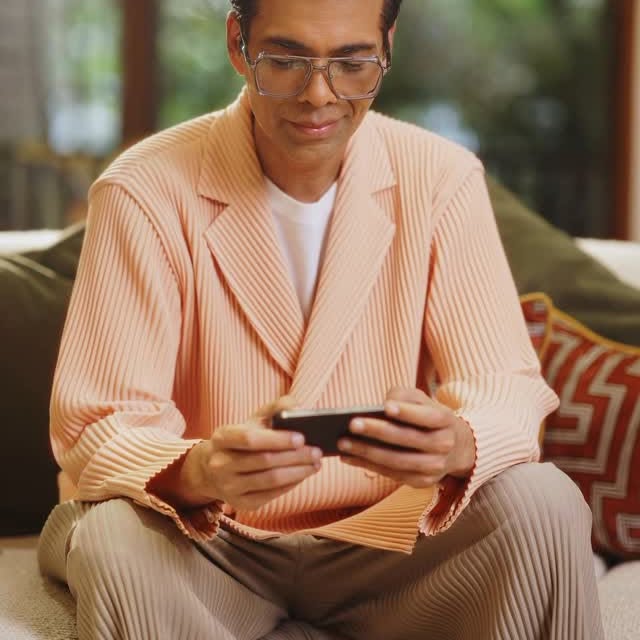 Instagram post by @karanjohar for Asian Paints. Caption reads: They say a home holds your story; and mine has....