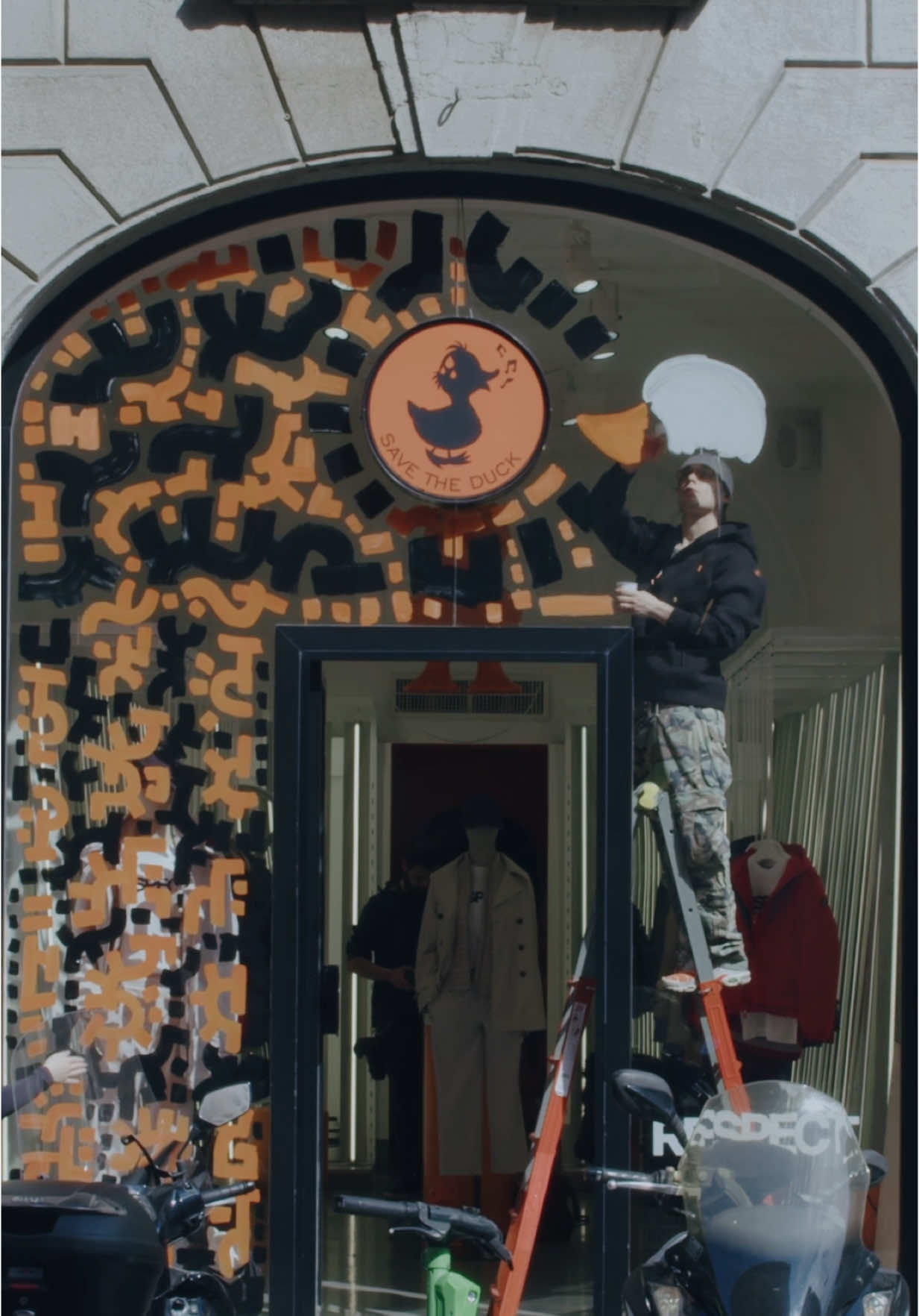 TikTok post by @davidevavalaa for Save The Duck. Caption reads: Milano Design Week was lit. Custom ducks and....