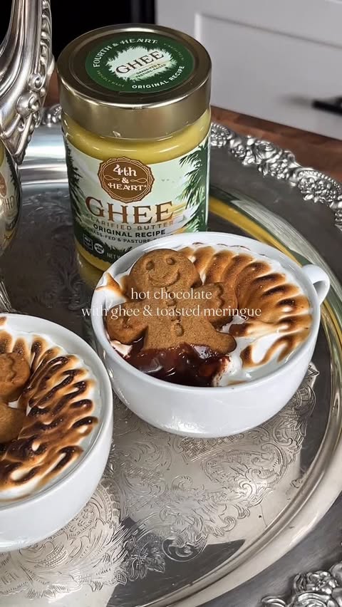 Instagram post by @athomewithkimmm for 4th & Heart. Caption reads: Adding a fun secret ingredient to my hot cocoa to....