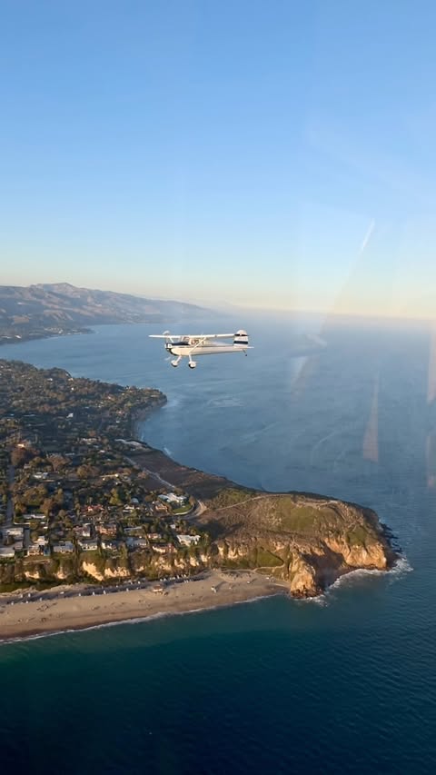Instagram post by @bayflight for GoPro. Caption reads: 140 cruising over Point Dume, captured on @gopro....