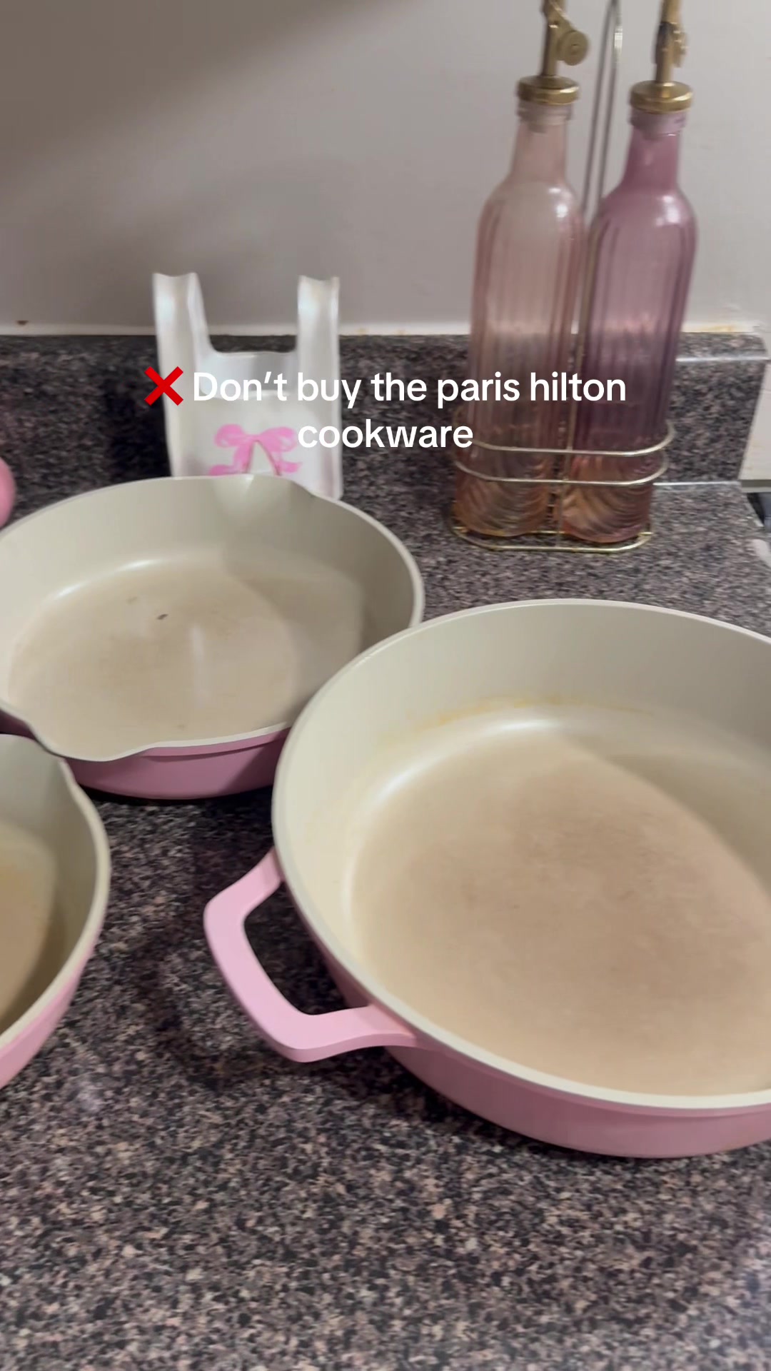 TikTok post by @abigailpgh for Carote. Caption reads: [...] the perfect pans for my pink kitchen 💖....
