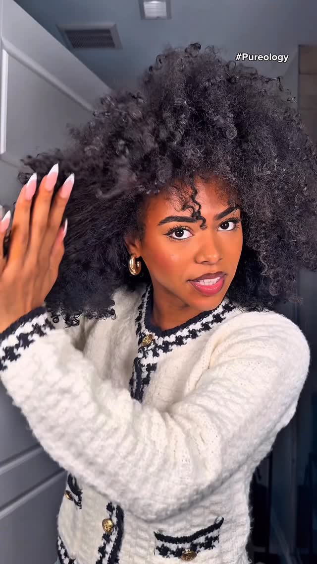 Instagram post by @destineewray for Pureology. Caption reads: Rehydrating my afro is usually a whole process,....