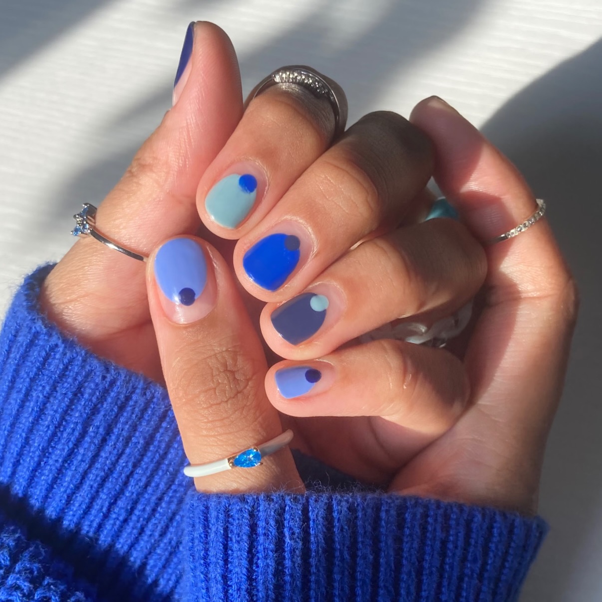 Instagram post by @nonnailartist for Olive & June. Caption reads: 🥹 blue cremes are the best 💙🩵🦕🌀🧞‍♂️🫐🫂....