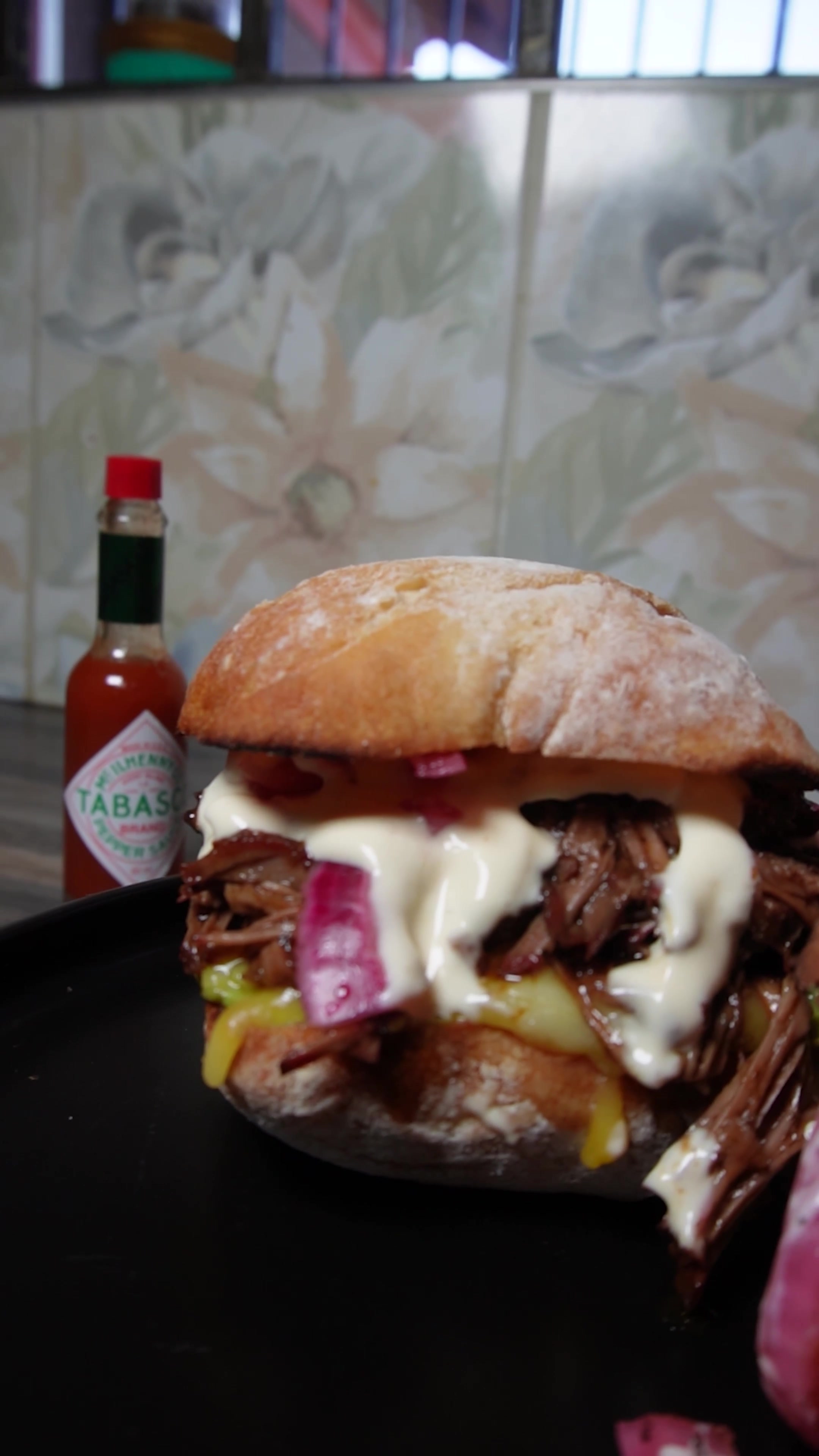 TikTok post by @dali_danger for TABASCO. Caption reads: [...] sandwich got the full glow-up with that....