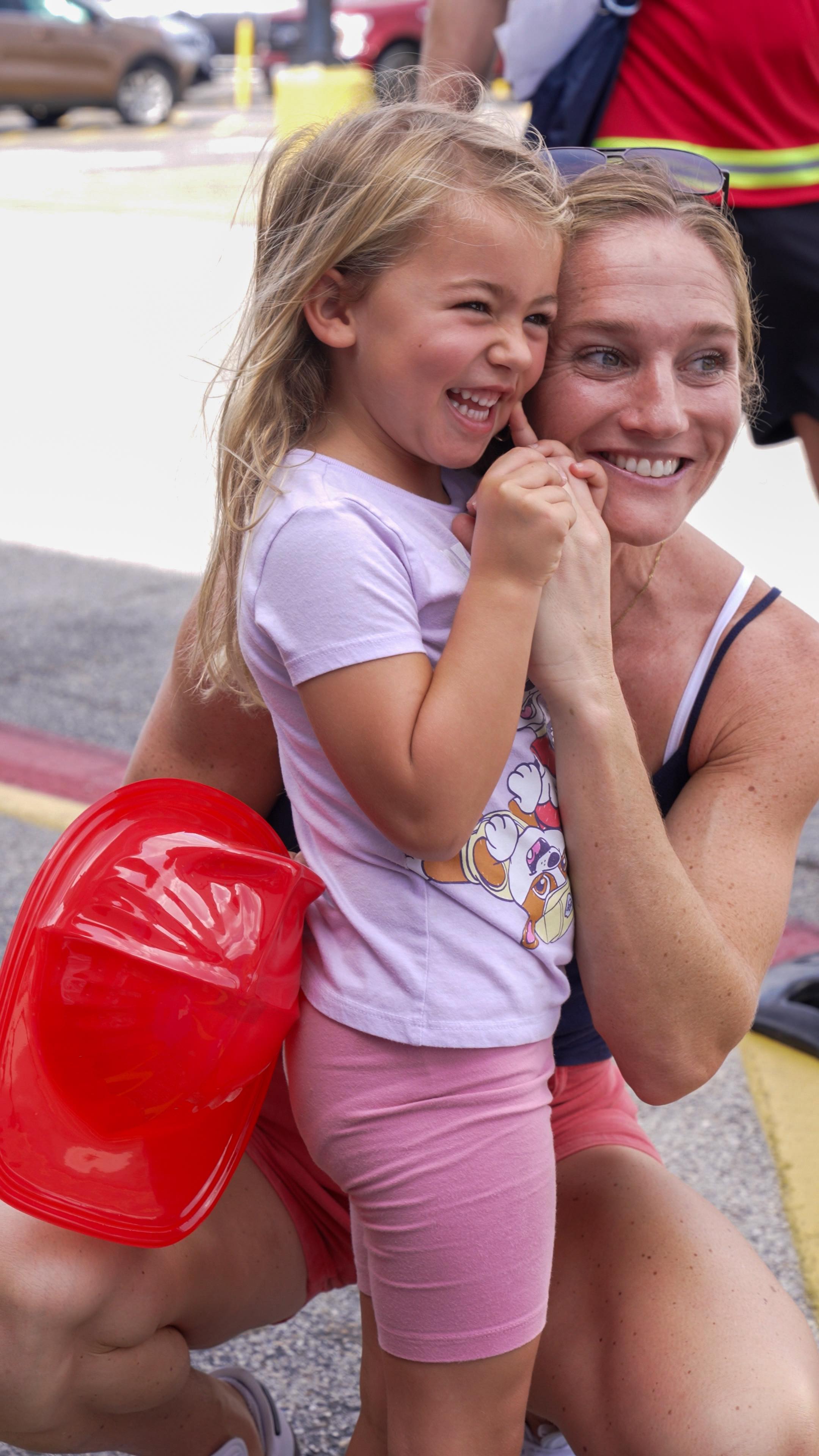 Instagram post by @carlilloyd3 for PAW Patrol. Caption reads: [...] meet her favorite pup, Skye, at the PAW....