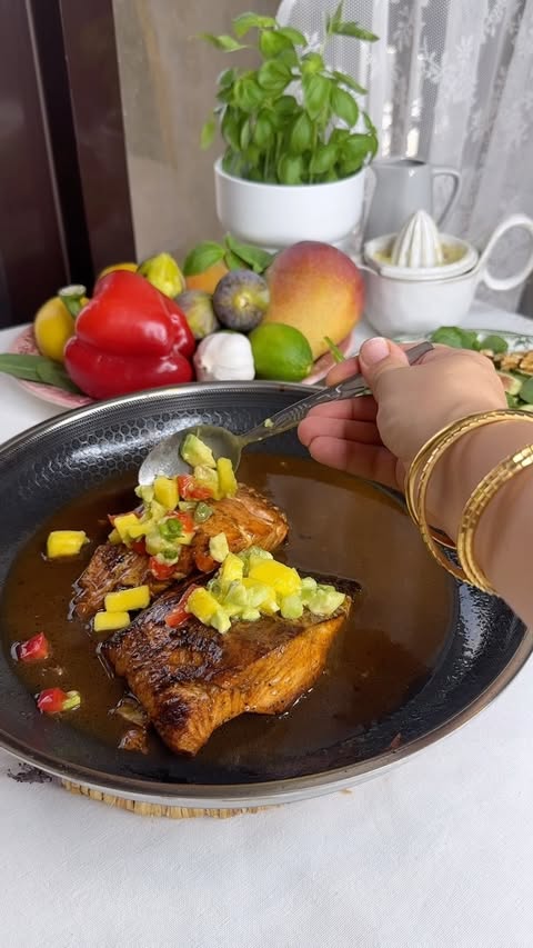 Instagram post by @nouraghunaim for HexClad. Caption reads: [...] lemon salmon, perfectly seared in my HexClad....