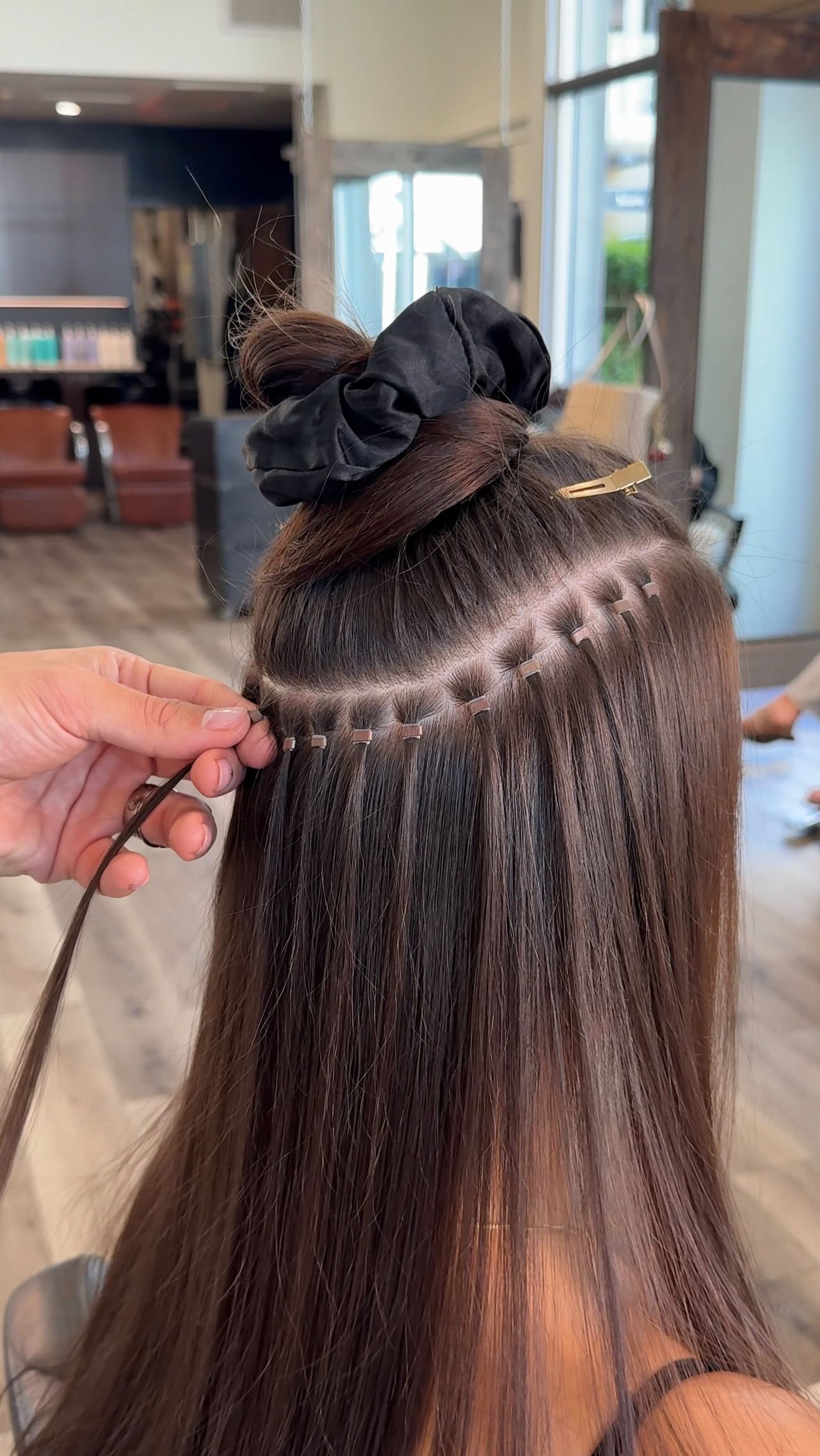 Instagram post by @antestradahair for Donna Bella Hair. Caption reads: Extensions aren’t just for length 👀 Sometimes one....