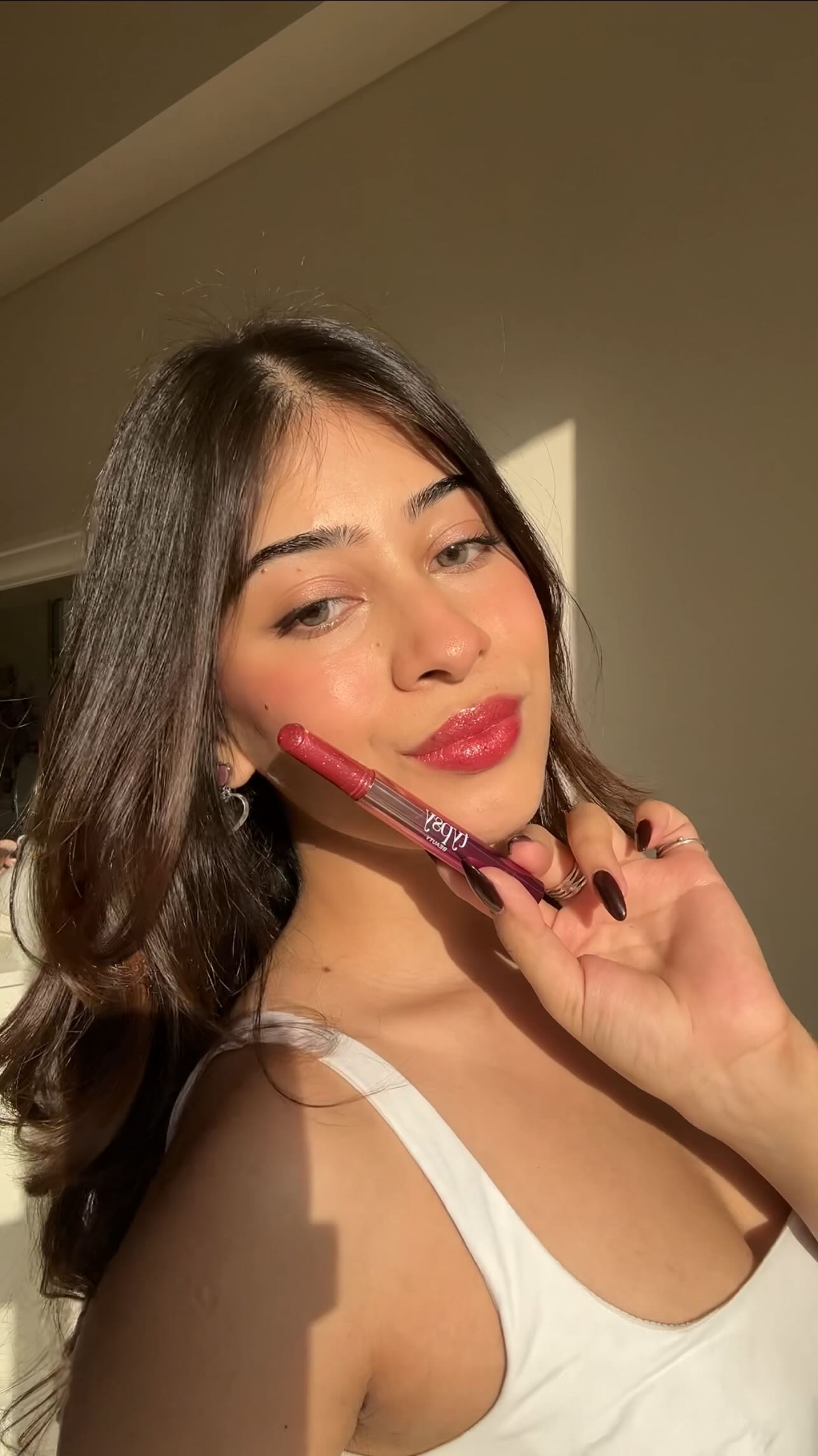 Instagram post by @nandini_malviya for Typsy Beauty. Caption reads: Gloss so good, you'll wanna kiss yourself 💗....