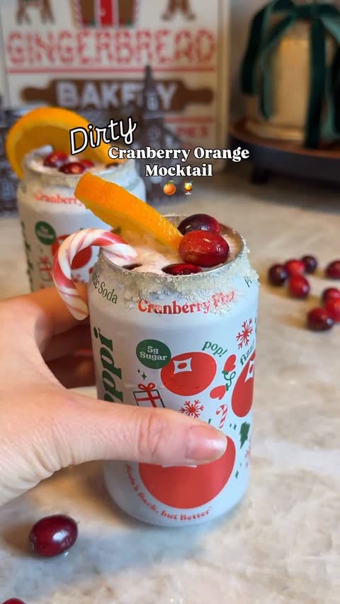 Instagram post by @celenakinsey for Poppi. Caption reads: This dirty cranberry mocktail was a 5 ⭐️....