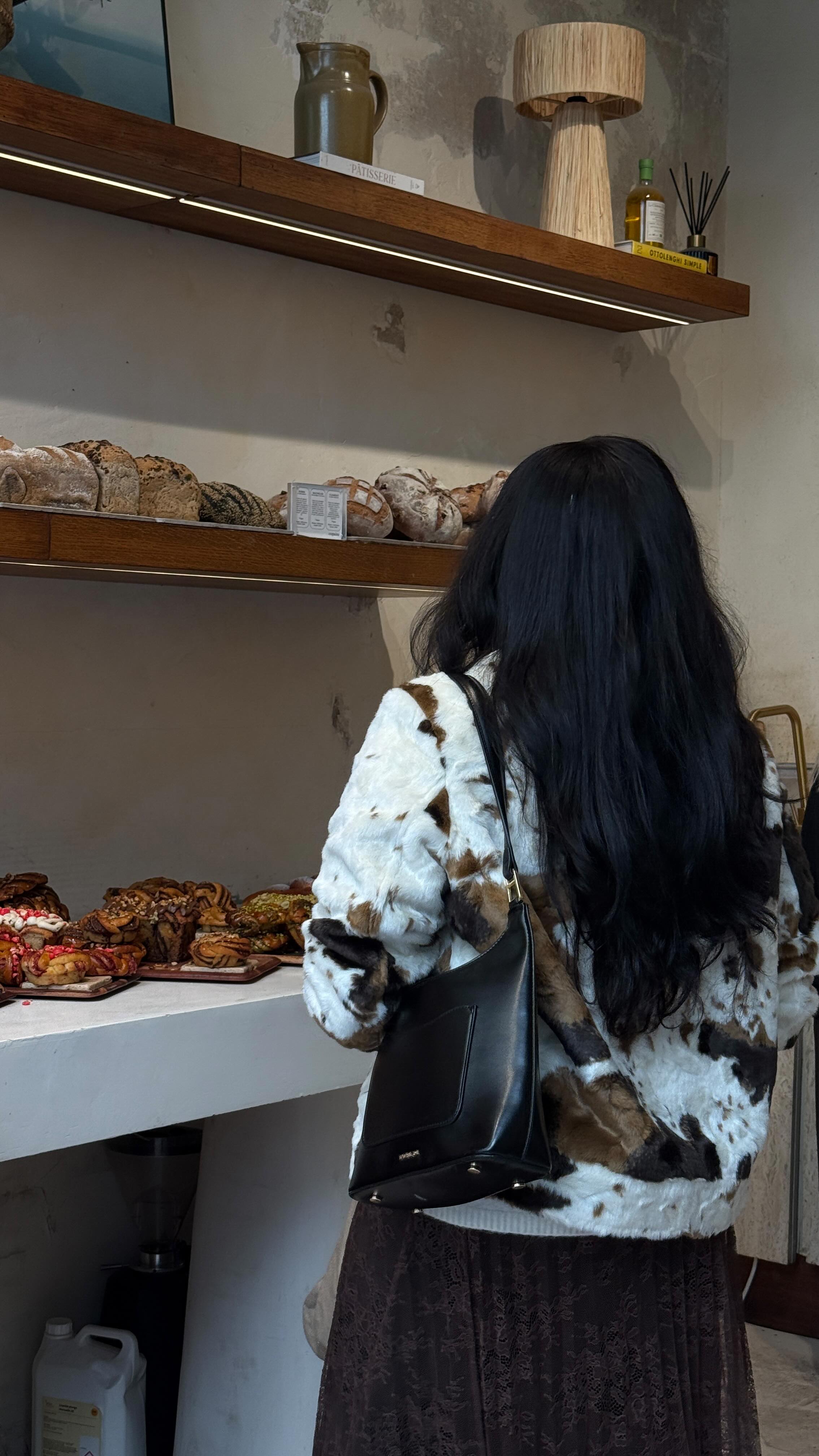 Instagram post by @iamnkirote for ARKET. Caption reads: never met an @arketofficial skirt I didn’t love!....