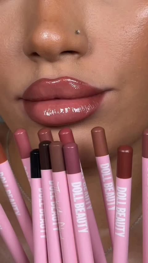 Instagram post by @hannahmsophia for Doll Beauty. Caption reads: swatching all 20 shades of the Doll Beauty....