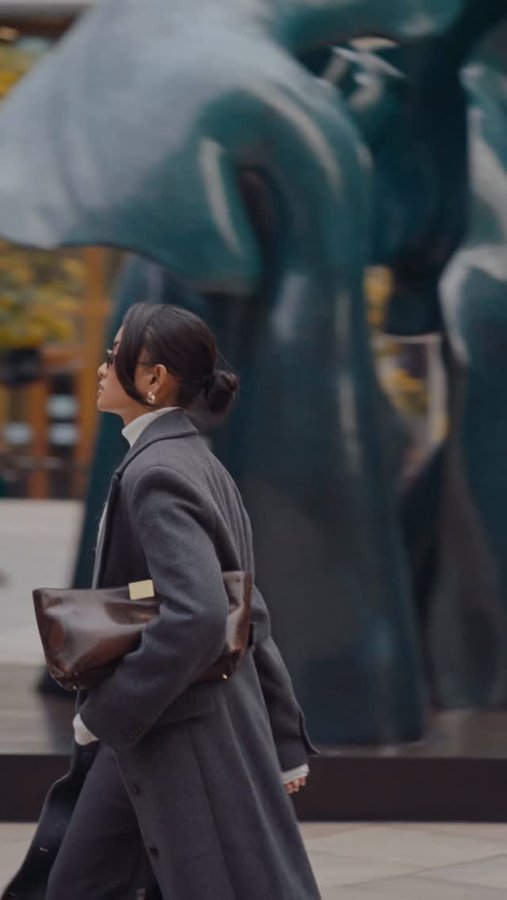 Instagram post by @aanishagurung_ for The Couture Club. Caption reads: AD. Fall layering, in motion. @thecoutureclub ☕️.