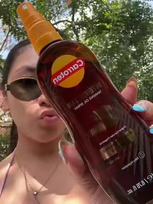 TikTok post by @aubrianazepeda for Carroten Greece. Caption reads: Love this oil 😍😍 #tanningoil @CARROTEN #carroten.