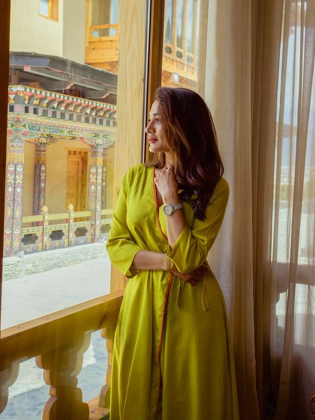 Instagram post by @piyusha.sharma.official for Taj Hotels. Caption reads: Lemon green… like the valley chose me today 🌿 At....
