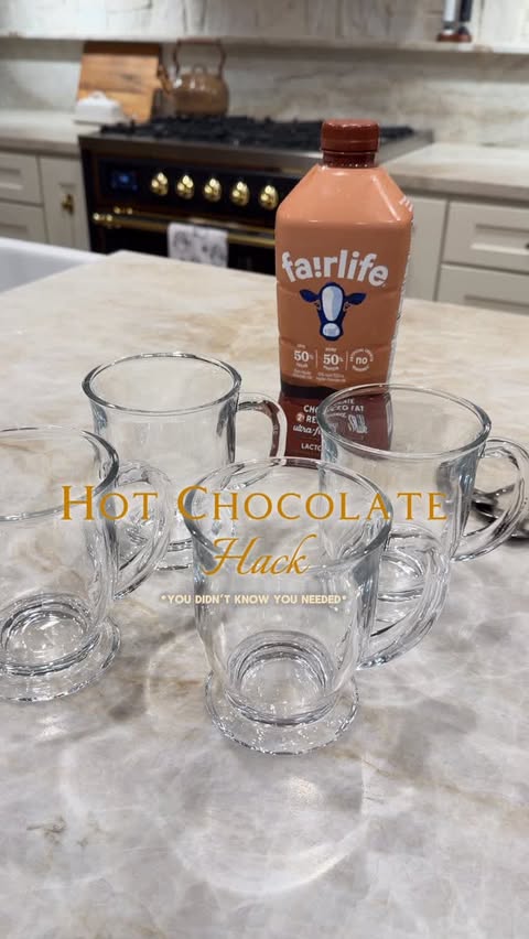 Instagram post by @caitlin.teal for fairlife. Caption reads: [...] packets and making hot chocolate with....