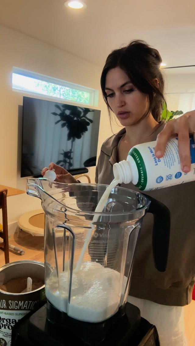 Instagram post by @therealpaigedanielle for Four Sigmatic. Caption reads: BEST MILKSHAKE w/ 20g of protein!
1.5 cups milk 
1....