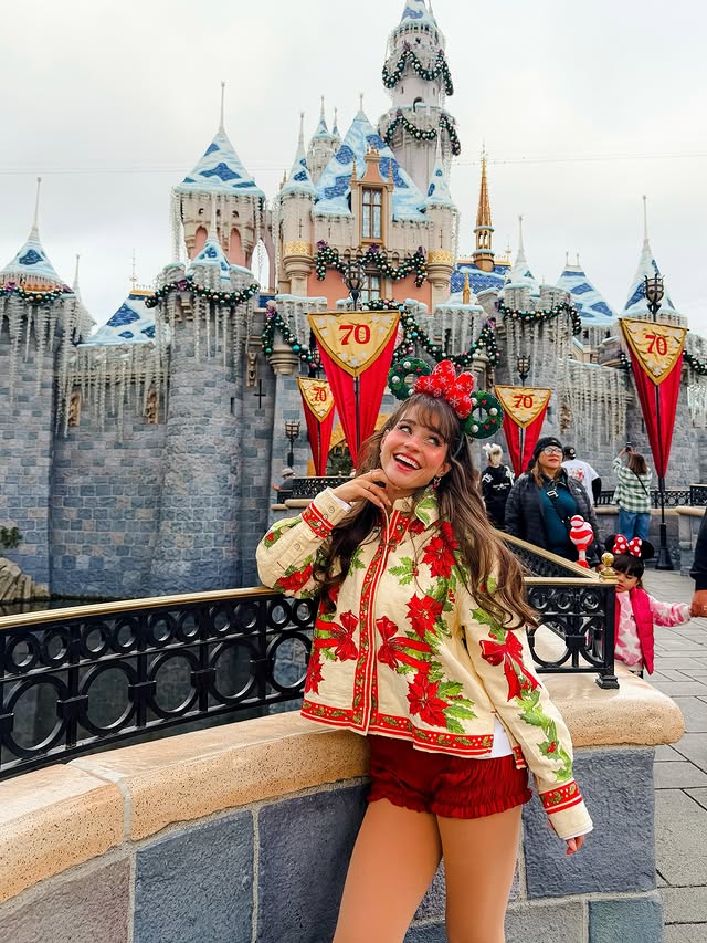 Instagram post by @magicwithmeg for Undercover Tourist. Caption reads: bby’s first christmas in disneyland....