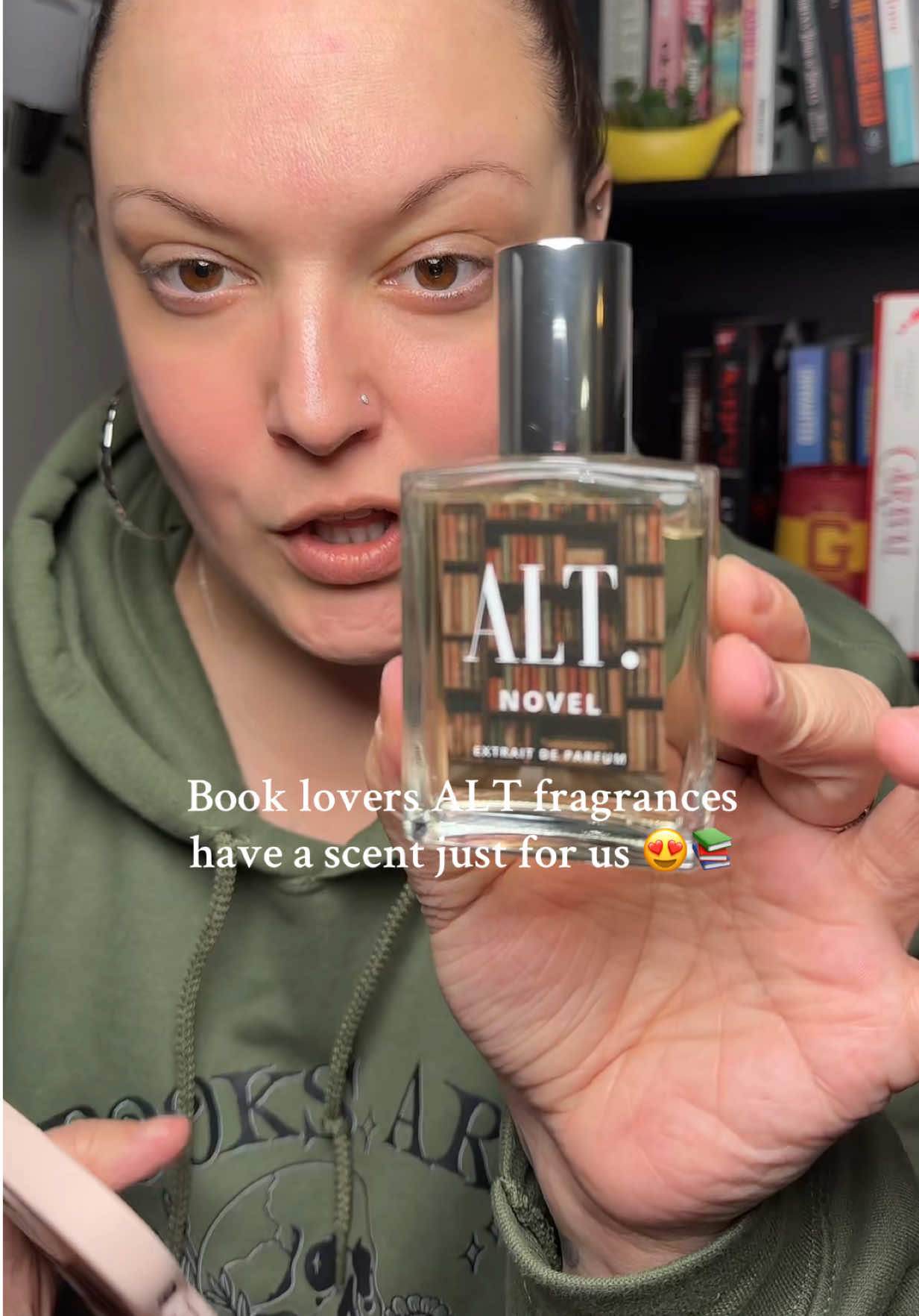 TikTok post by @izzysbookshelfie for ALT. Fragrances. Caption reads: Novel by @ALT. Fragrances is a book lovers dream....