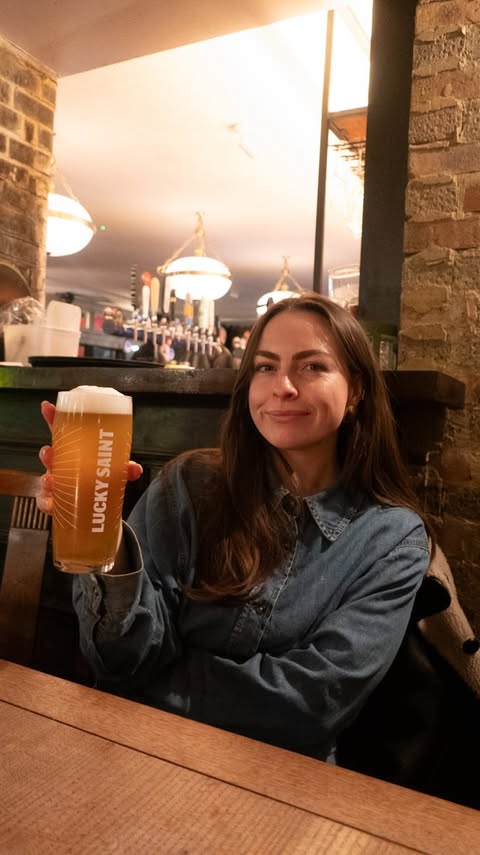 Instagram post by @georgieeats for Lucky Saint. Caption reads: AD January usually means cancelling plans…but not....