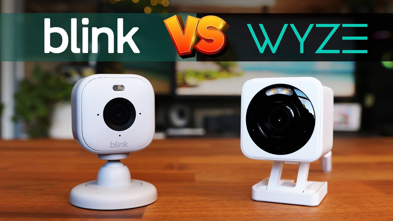 YouTube post by @SteveDOES for Wyze. Caption reads: Blink Mini 2 VS Wyze Cam v4 - Who's Better?.